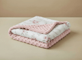 Soft floral pink baby blanket with dotted backing