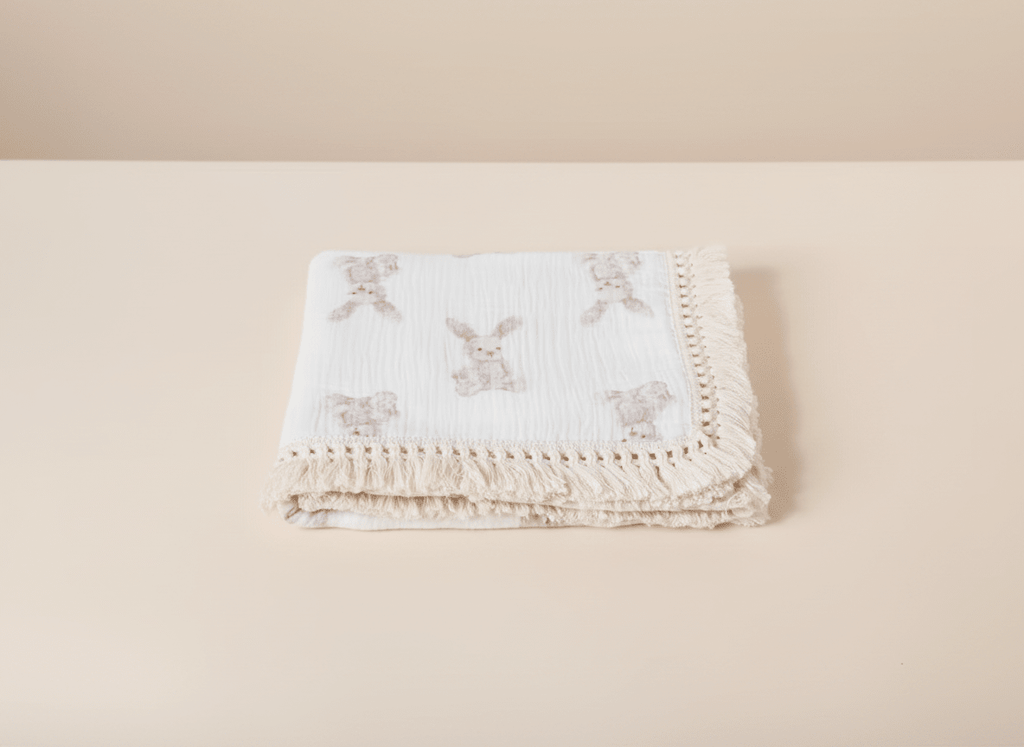 Soft bunny-themed beige baby blanket