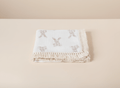 Soft bunny-themed beige baby blanket