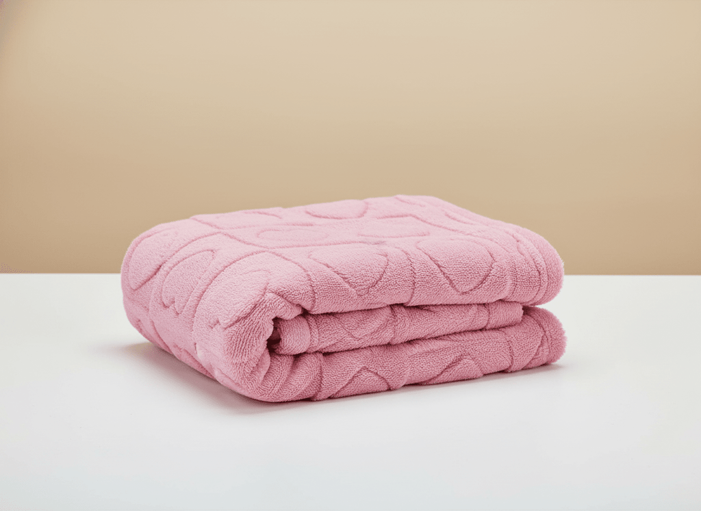 Soft heart-themed pink baby blanket